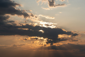 Cloude sky at sunset rays abstract background.