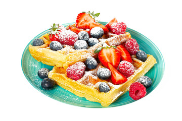 waffles with berries isolated on white