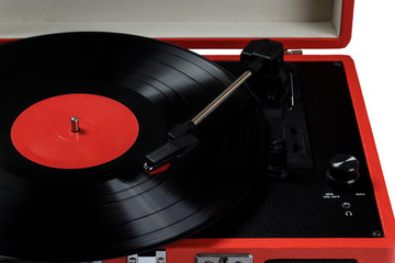 Vintage styled vynil player and a vynil record. Close up