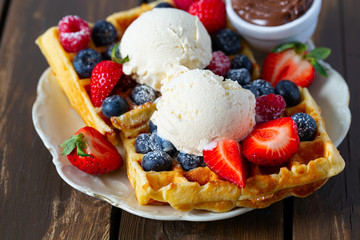sweet belgian waffles with berries and ice cream