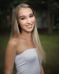 Naklejka premium One beautiful young blond woman with white strapless tank top