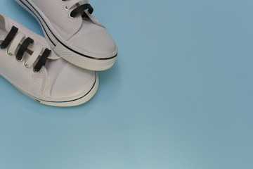 A pair of sports shoes partially.