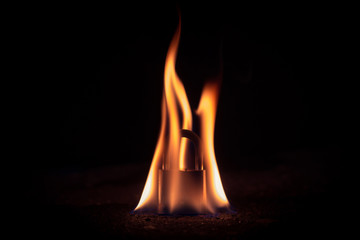 The padlock is lit on fire on a black background