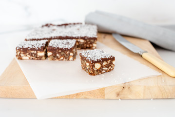 Chocolate hedgehog slice. This old fashioned treat is made from plain biscuits, chocolate, coconut, butter and walnuts and is a popular homemade sweet snack or part of an afternoon tea in Australia