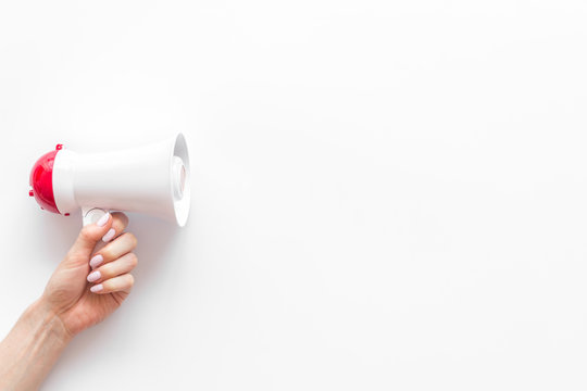 Attract attention with megaphone on white background top view copyspace