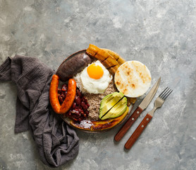 Colombian food. Bandeja paisa, typical dish at the Antioquia region of Colombia - chicharrón...