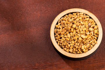 Fenugreek seeds. Trigonella foenum-graecum. Text space