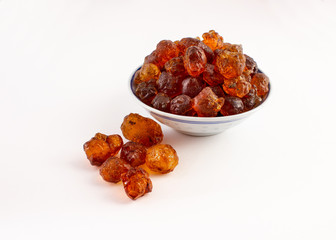 group of peach gum in plate on white background..