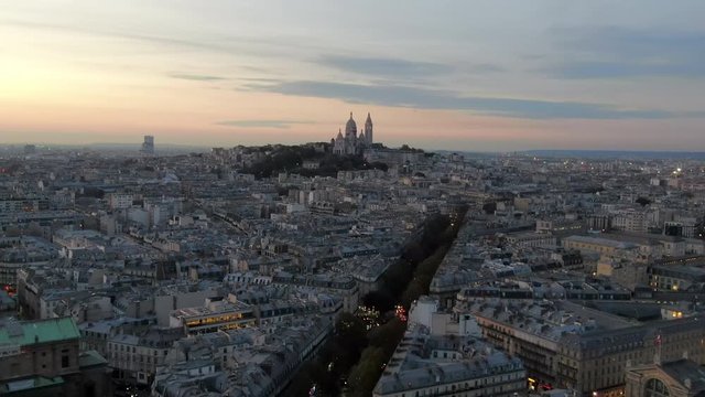 Aerial: Early Evening Paris Cityscape with the Sacre-Cur Rising Above