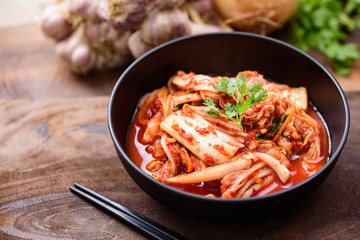 Kimchi cabbage in a bowl with chopsticks, Korean food
