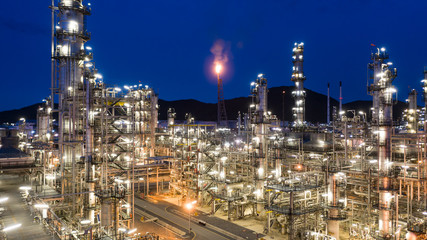 Aerial view petrochemical plant and oil refinery plant background at night,  Petrochemical oil refinery factory plant at night.