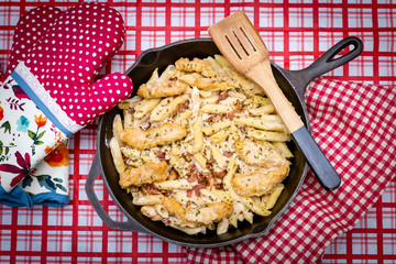 chicken penne dinner in cast iron pan.