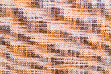 Hessian sackcloth burlap woven texture background / cotton woven fabric background with flecks of varying colors of beige and brown. with copy space. office desk concept.