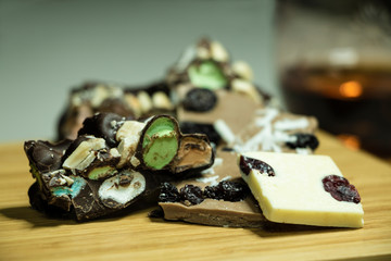 pieces of handmade black and white chocolate stuffed with coconut, raisins and marzipan