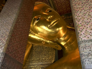 close shot of the reclining buddha at wat pho temple in bangkok