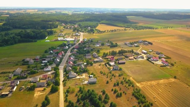 Flight over small village in Poland. 4k aerial footage.