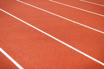 Fototapeta premium Red treadmill in sport field. Healthy and sporty lifestyles concept
