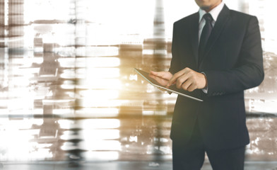 Businessman using digital tablet in hand