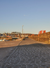 Looking along the Harbour Wall of Arbroath Harbour in the evening light.