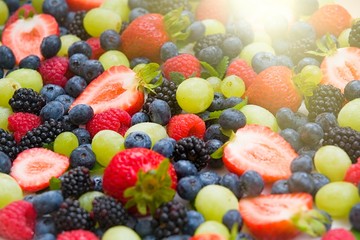 Fototapeta na wymiar Fresh mixed fruits, berries background.Healthy food , diet.