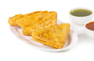 Indian Fried Snack Bread Pakora. It is also known as bread bhaji. A common street food, it is made from bread slices, gram flour, and spices among other ingredients