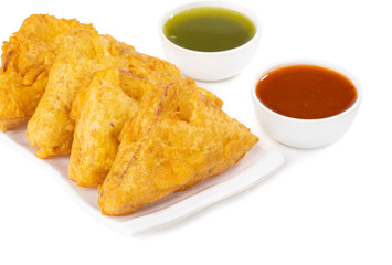 Indian Fried Snack Bread Pakora. It is also known as bread bhaji. A common street food, it is made from bread slices, gram flour, and spices among other ingredients