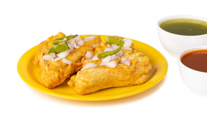 Indian Fried Snack Bread Pakora. It is also known as bread bhaji. A common street food, it is made from bread slices, gram flour, and spices among other ingredients