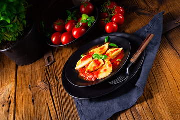 ravioli alla genovese with basil tomato sauce