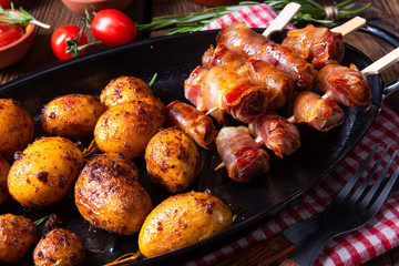 Rustic dates wrapped in bacon and young roasted potato.