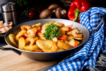 a delicious fried potato and shrimp pan