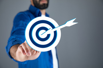 man hand target in screen on brown background
