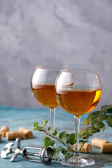 Two glasses with white wine on a textural background. Copy space. Place for your text.