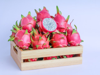dragon fruit in basket on white background