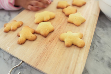 Happy time for kids are preparing the dough, bake cookies in the kitchen, gingerbread man cookies,Christmas baking preparation. 