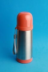 orange thermos to keep the drink hot