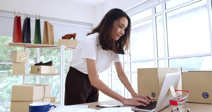 Young asian woman with startup small business entrepreneur freelance working at home