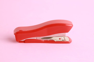 red stapler in color background