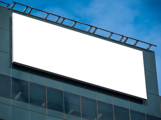 Blank white rectangle billboard on modern office building with glass facade. 