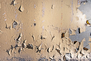 Old wall with cracked paint painting texture background