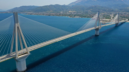 Aerial drone photo of modern cable anti seismic bridge crossing deep blue sea