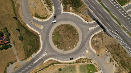 Aerial drone photo of modern motorway roundabouts of Ionia Odos near famous cable bridge of Rio - Antirio Harilaos Trikoupis, Antirio, Greece