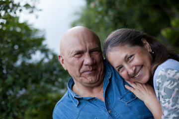 Mature couple in summer country garden