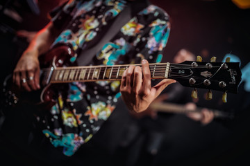 men playing guitar in night club