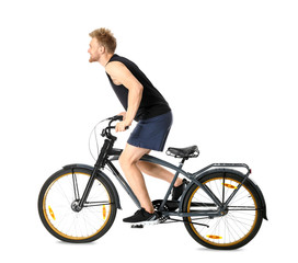 Fototapeta na wymiar Sporty young man riding bicycle against white background