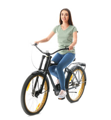 Beautiful young woman riding bicycle against white background