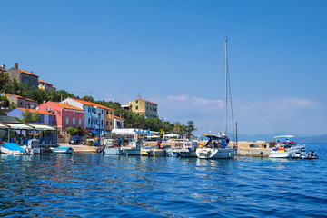Fototapeta na wymiar village Valun with harbor and boats, Cres island, Croatia.