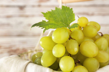 Tasty fresh grapes in basket, closeup
