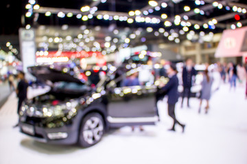 blurred people in motor show