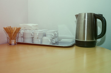 cups, teapot on the office table