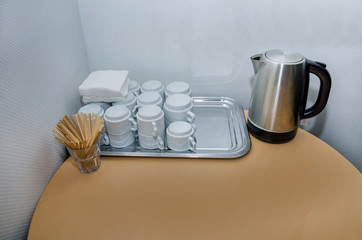 cups, teapot on the office table